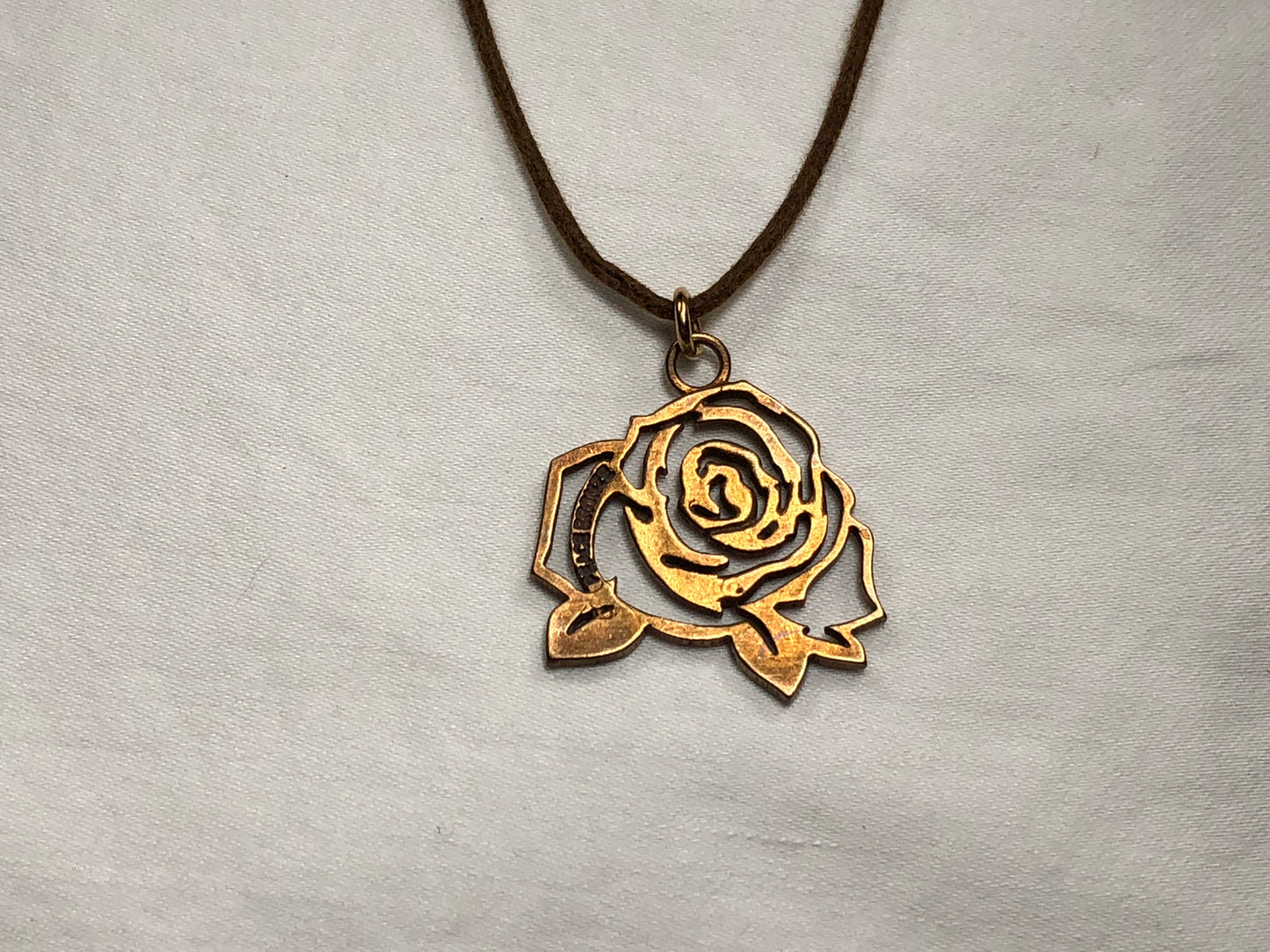 The Mighty Rose Pendant Necklace in Bronze Finish on Adjustable Natural Fiber Cord